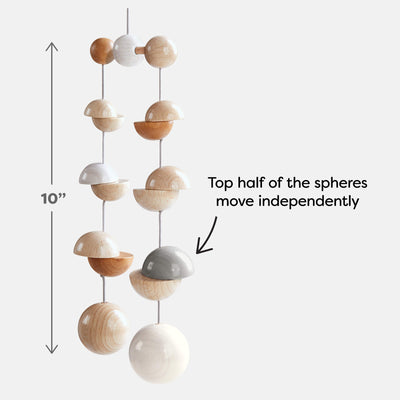 A decorative hanging mobile featuring wooden spheres in various shades, with a height of 10 inches and movable top halves.