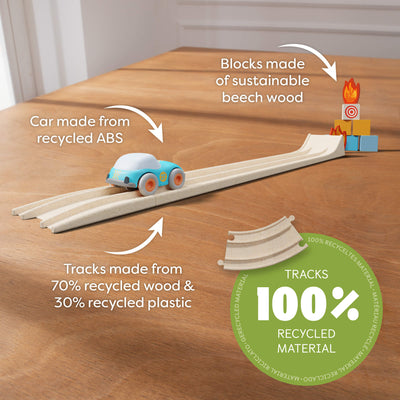 Toy car track set on a table highlighting eco-friendly materials used for cars, blocks, and tracks. with the words "Car made from recycled ABS. Blocks made of sustainable beech wood. Tracks made from 70% recycled wood & 30% recycled plastic. Tracks 100% Recycled Material"