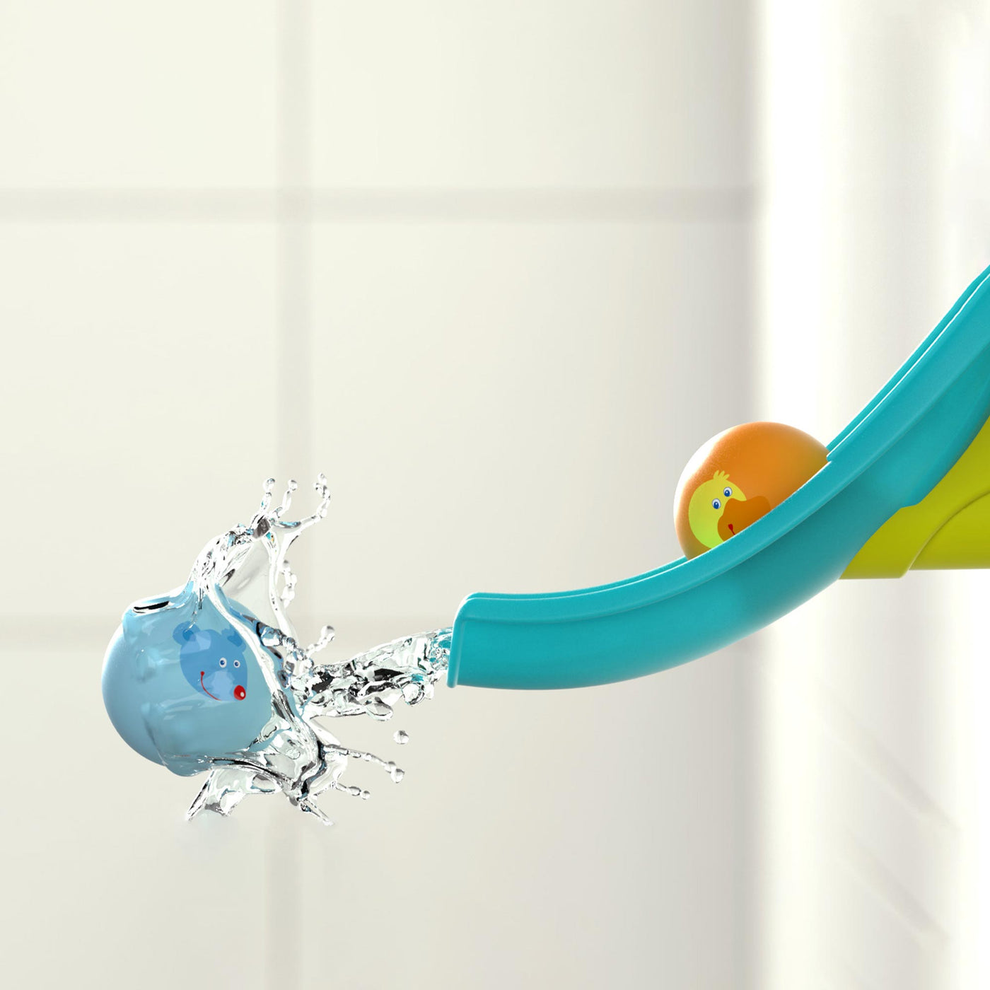 Toy bath slide with orange and blue balls, water splashing from the blue ball.