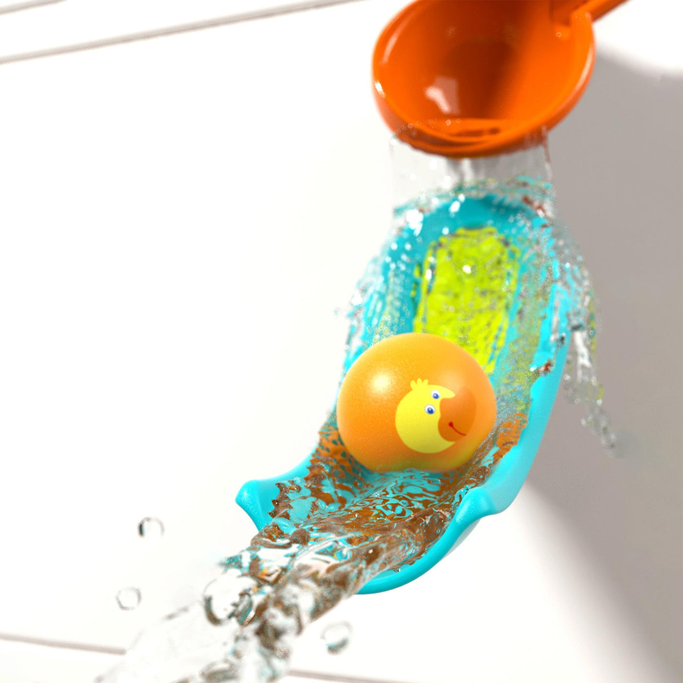 Water toy setup with an orange ball featuring a duck face rolling down a blue slide with splashing water.