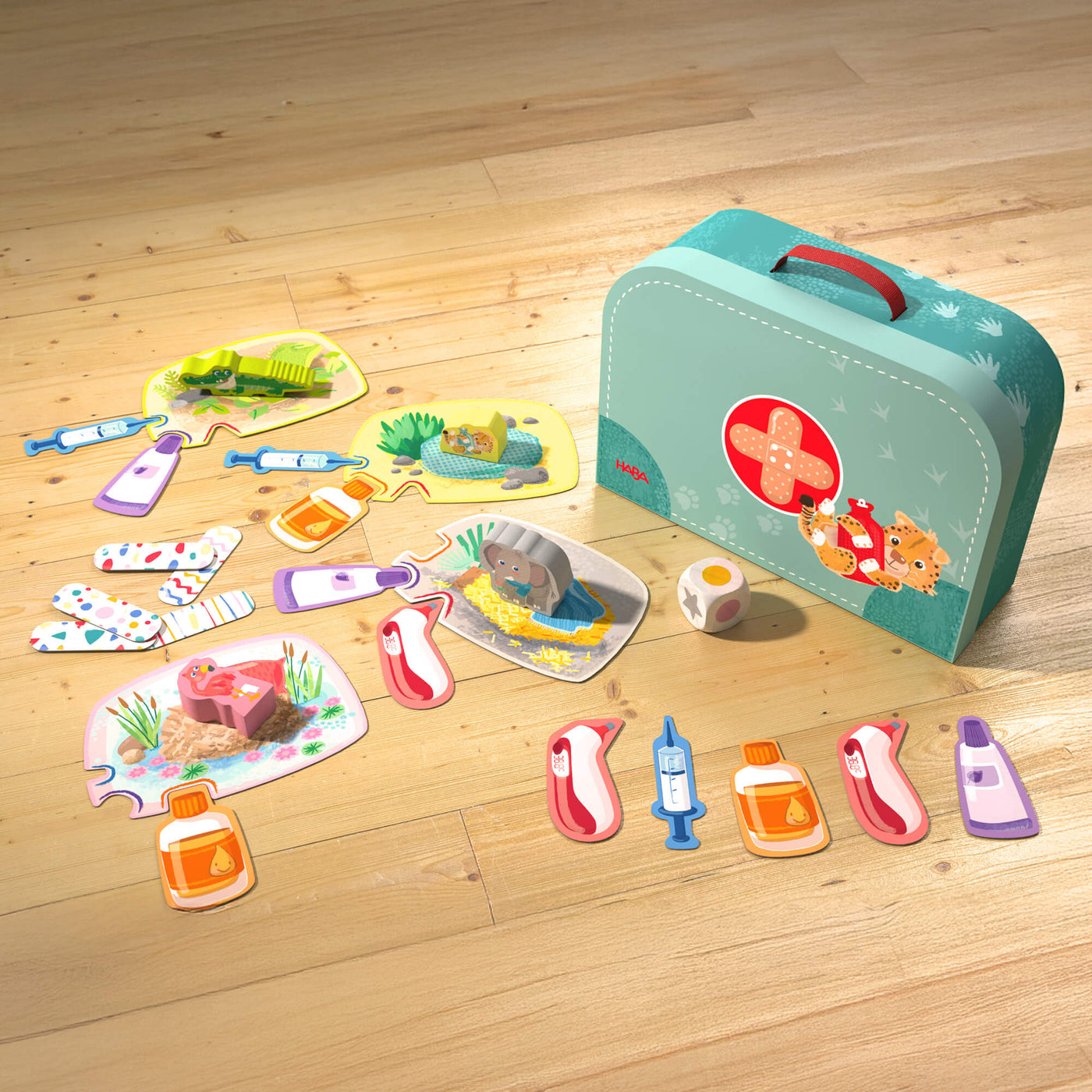 Children's game with a toy vet's case, assorted animal-themed pieces, medical items, and a wooden die.