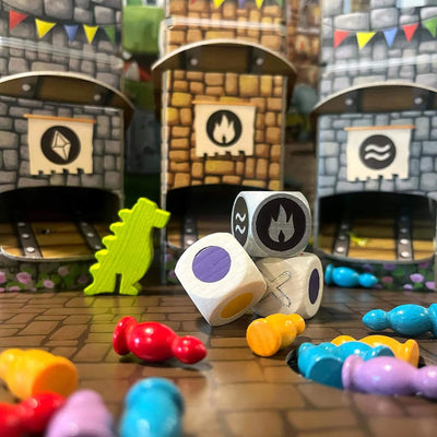 Close-up of board game pieces, including dice with symbols and colorful pawn-shaped figures, and a dragon in front of castle-themed towers.