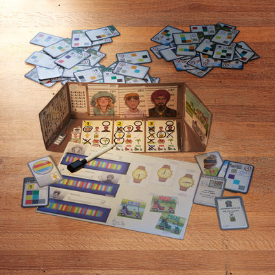 Top-down view of The Key game with character cards, note sheets, and scattered icon cards on a wooden table.