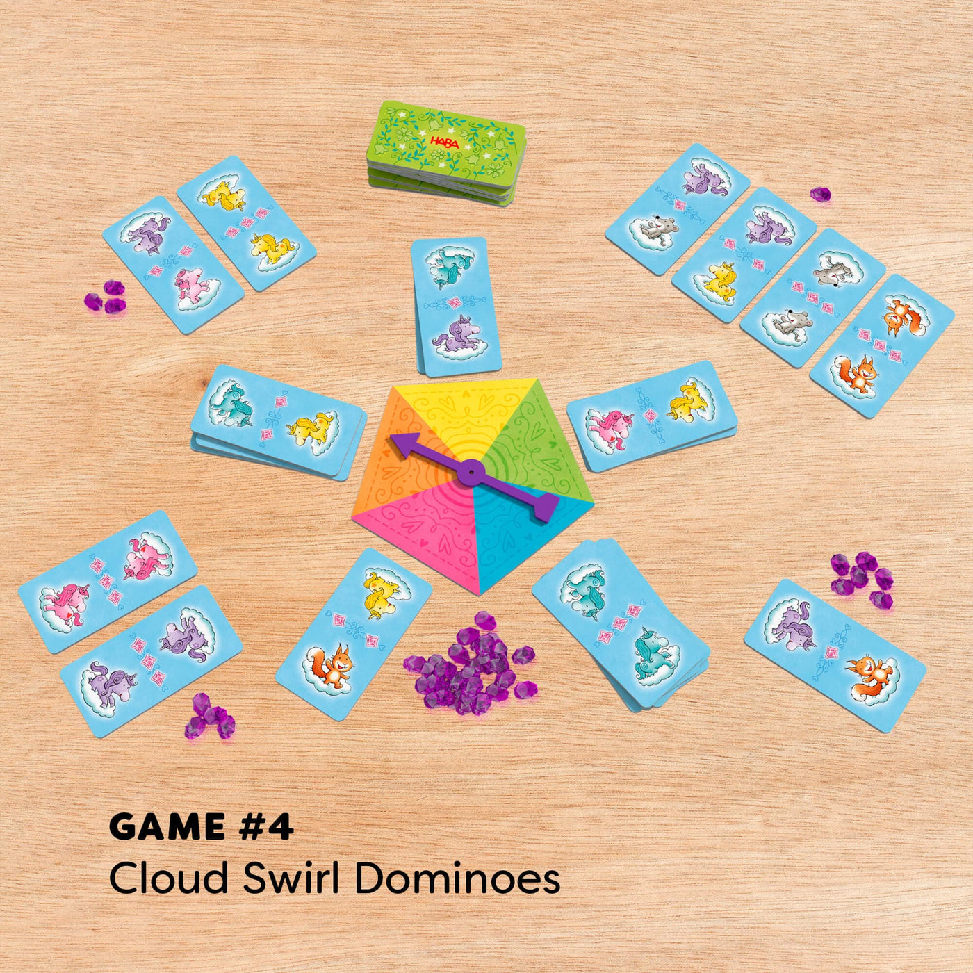 Game 4 Cloud Swirl Dominoes with rainbow spinner and purple gems