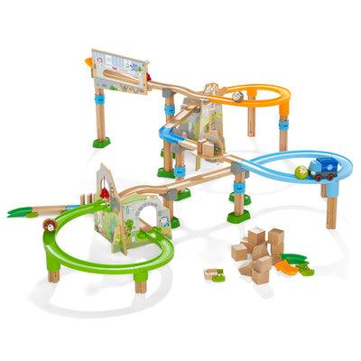 Kullerbu Mountain Adventure Track Set with wooden piece and orange, blue, and green loops, blue truck, wooden ball with bear face, wooden ball with flower, wooden ball with cow face