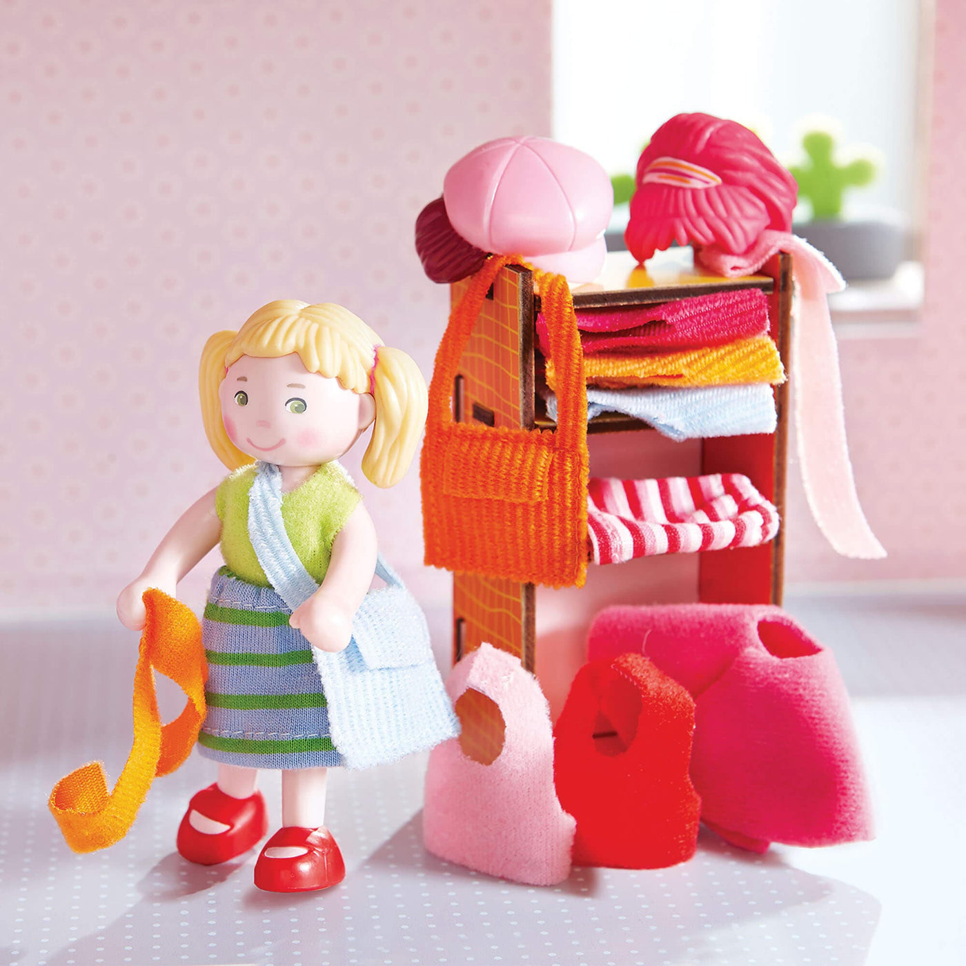 Little Friends Feli with Accessories folded on a dressor