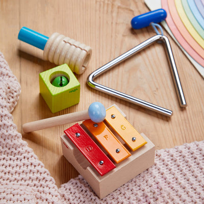 Musical Sounds Musical Joy instruments on wooden floor