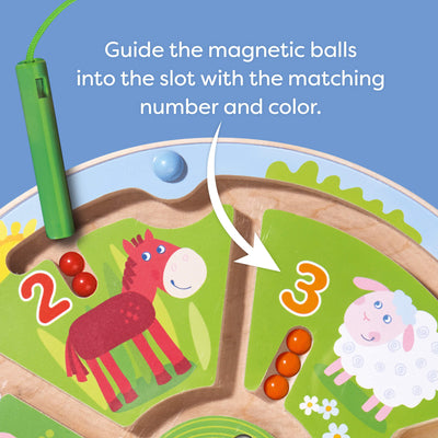 Guide the magnetic balls into the slot with the matching number and color.